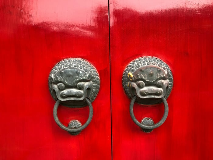 asian red doors with dragon iron handles